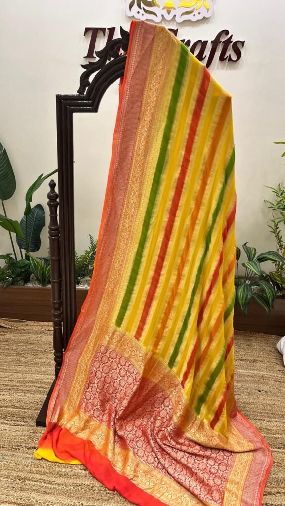 orange gold stripe georgette saree with zari border and pallu motif orange gold stripe georgette saree with zari border and pallu motif